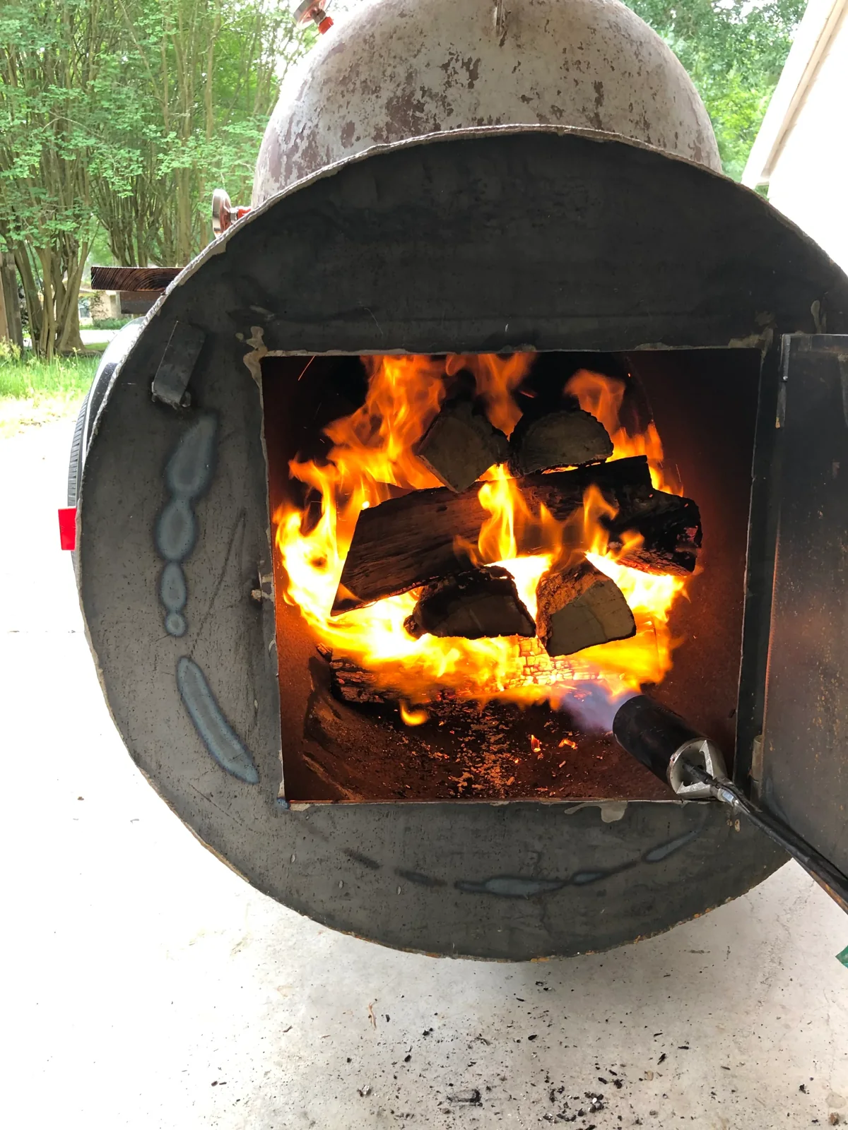 Fire burning in the AM Barbecue smoker